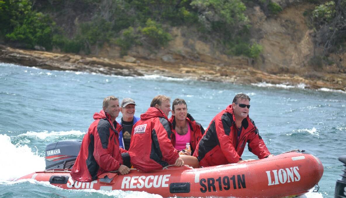 DUCK BOYS: Half of the Narooma vets team makes its way to the finish line via the rubber duck...