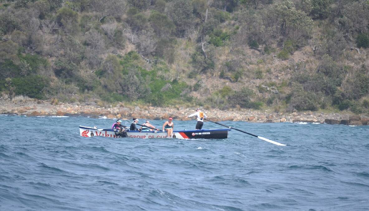 The Viking women  row to the finish at Bermagui in Day 4 of the 2013/2014 George Bass Surfboat Marathon.