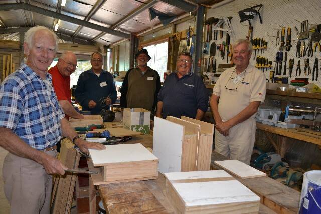 IN THE SHED: Busy at work in the Bermagui Wallaga Men’s Shed are Bob Whackett, Narooma Rotary Club president Terry Irvine, Nick Kopievsky, Kevin Allen, John Robinson and Keith Driver. Terry was helping the members make templates for the Narooma newspaper bag project, which turns Narooma News newspapers into recycled shopping bags. 