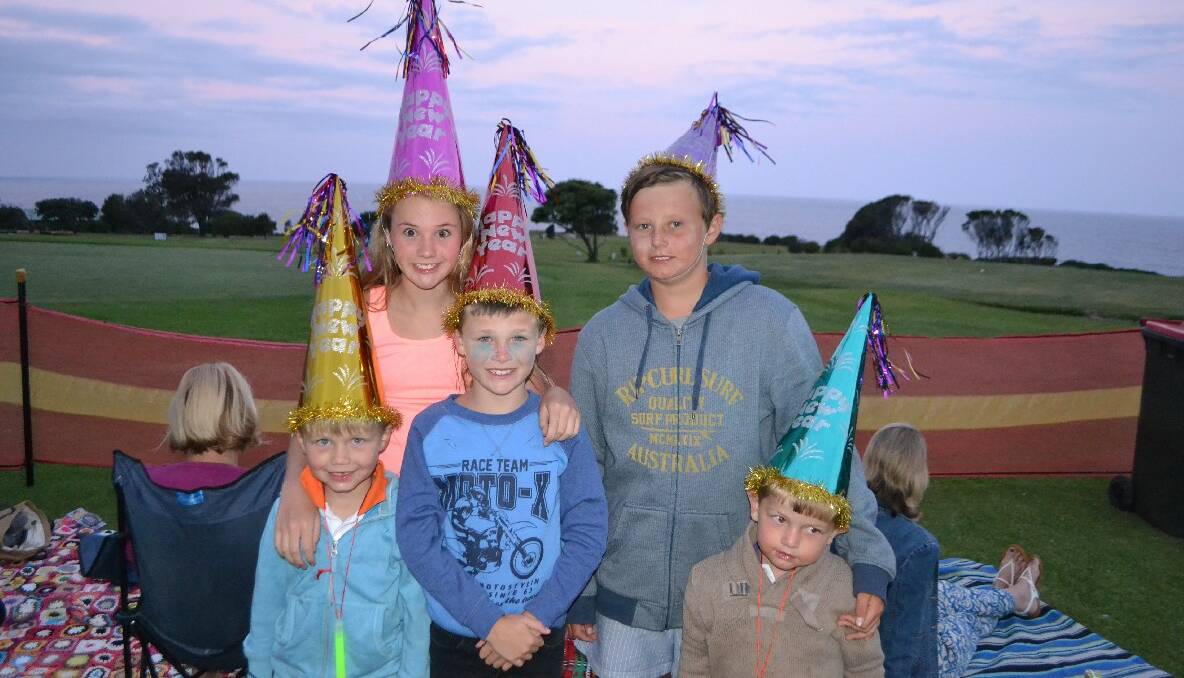 FIREWORKS HATS: Wearing their New Year hats and waiting for the New Year’s Eve fireworks at the Narooma Golf Club are the McDonald kids from Narooma – Hunter, Shaylee, Cohen, Mitchell and Tommy. Photo by Stan Gorton