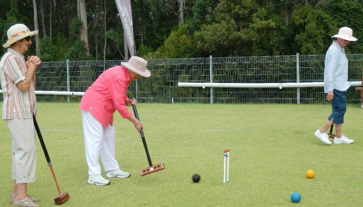 NAROOMA: Edna Falkiner executing a hoop with Thelma Colling and Delma Taylor counting the success.