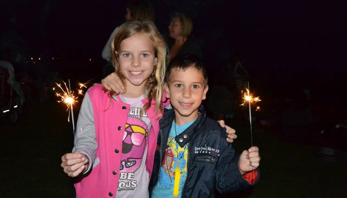   SPARKLER KIDS: Charlotte and Ethan Quick of Bodalla had sparklers out at the Narooma New Year’s Eve fireworks at the Narooma Golf Club. Photo by Stan Gorton