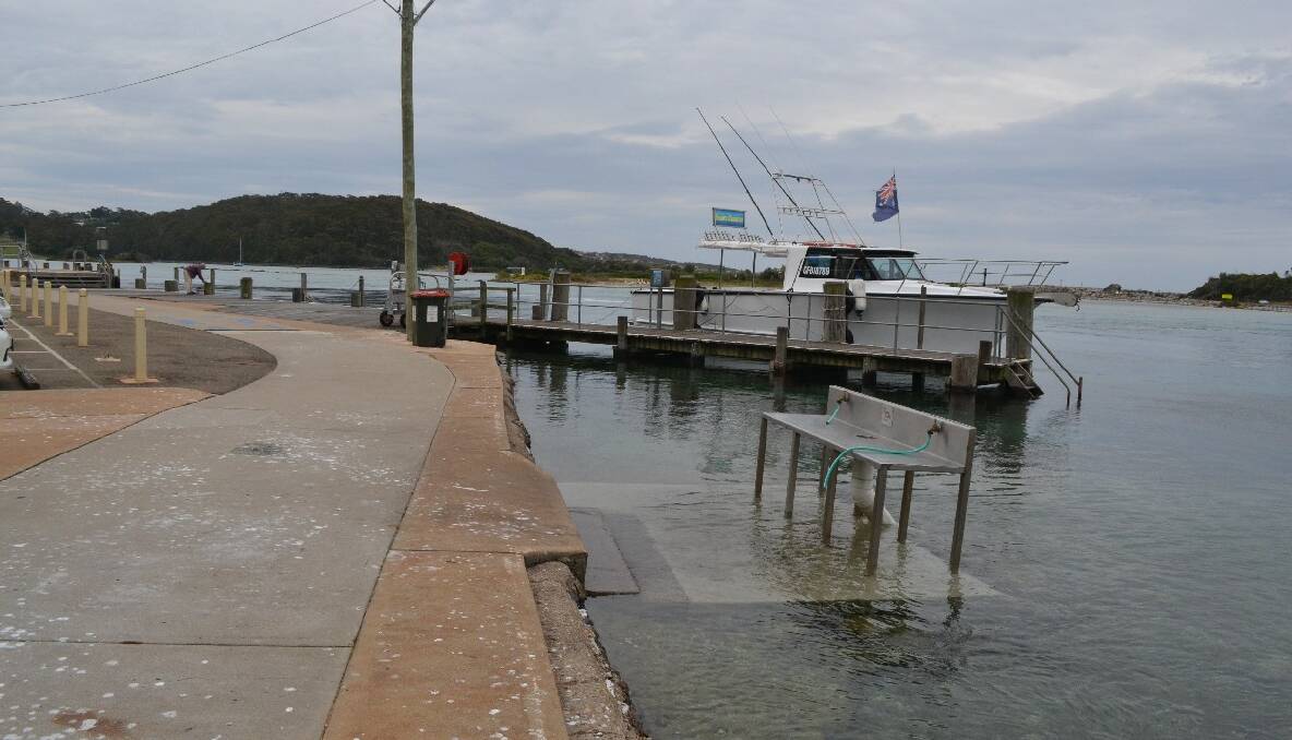 High tide at the Narooma main wharf on Friday morning (today). Photo by Stan Gorton