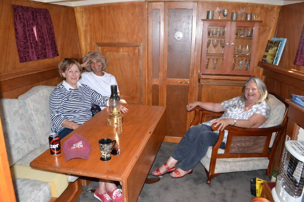 BELOW DECK: Chatting and relaxing in the cabin of the Paddy D are host Carmel McKay of Narooma, Faika Jappie of Brisbane and Susan Burgess of Bathurst. 