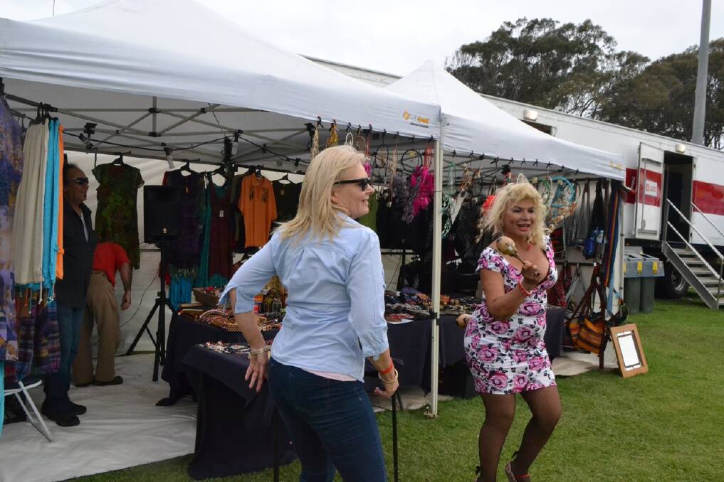 SALSA DANCERS: Juanita Hall and Illiana Ilacqua having a salsa dance at the Ponchitos market stall at the Narooma Blues Fest on Sunday afternoon.