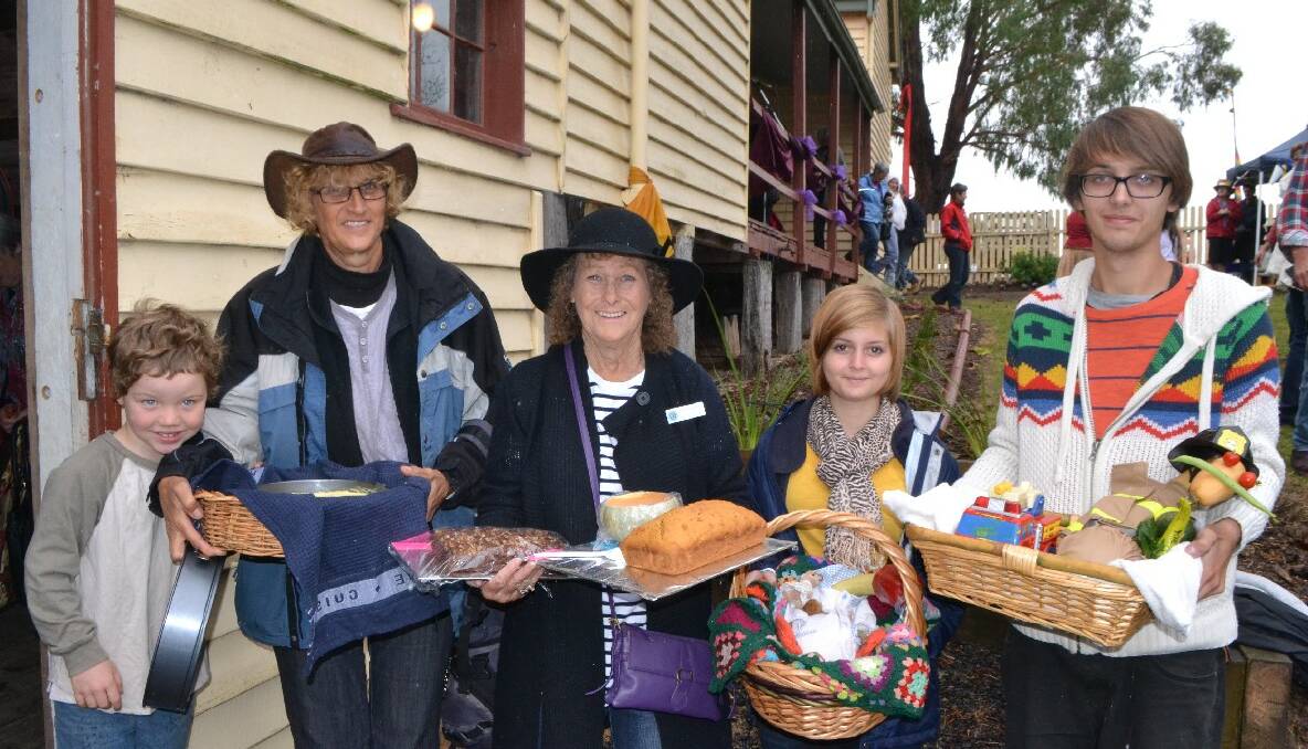 DISHES DELIVERED: Delivering their dishes and veggies to the Quaama Harvest Fair are Bailey and Hallie Fernandez-Markov from Brogo, Cobargo CWA member Dot Hathaway and Melanie and Julian Lindenfeld, WOOFers from Bavaria Germany being hosted by Hallie and Bailey. 