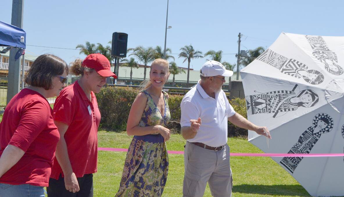 EVENT FOUNDER: Umbrellas of Bermagui founder and event coordinator Dennis Olmstead of Bermagui leads Catriona Rowntree on a tour of the umbrellas.