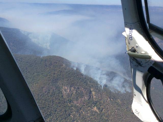 AERIAL VIEW: An aerial view over the Jillicambra fire west of Narooma taken from a firefighting helicopter being employed by National Parks.