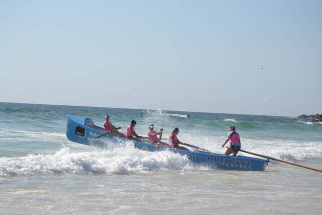 SURF ACTION: Broulee SLSC Surfers surfboat rowers in action in the surf at the Far South Coast Life Saving Club senior carnival hosted by Narooma SLSC. Photo by Stan Gorton – Narooma News 