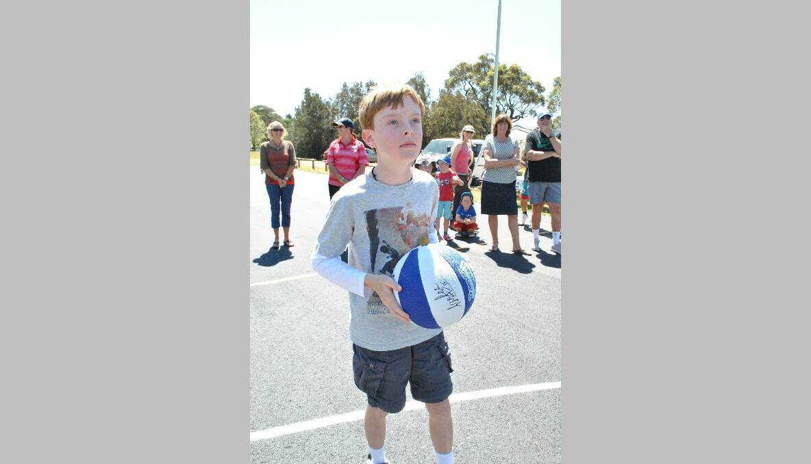 FIRST HOOP: Tuross Head youngster Vincent Edwards, 10, had the honour of throwing the first goal through the new reversible hoop at the court, which he managed on his first attempt.  