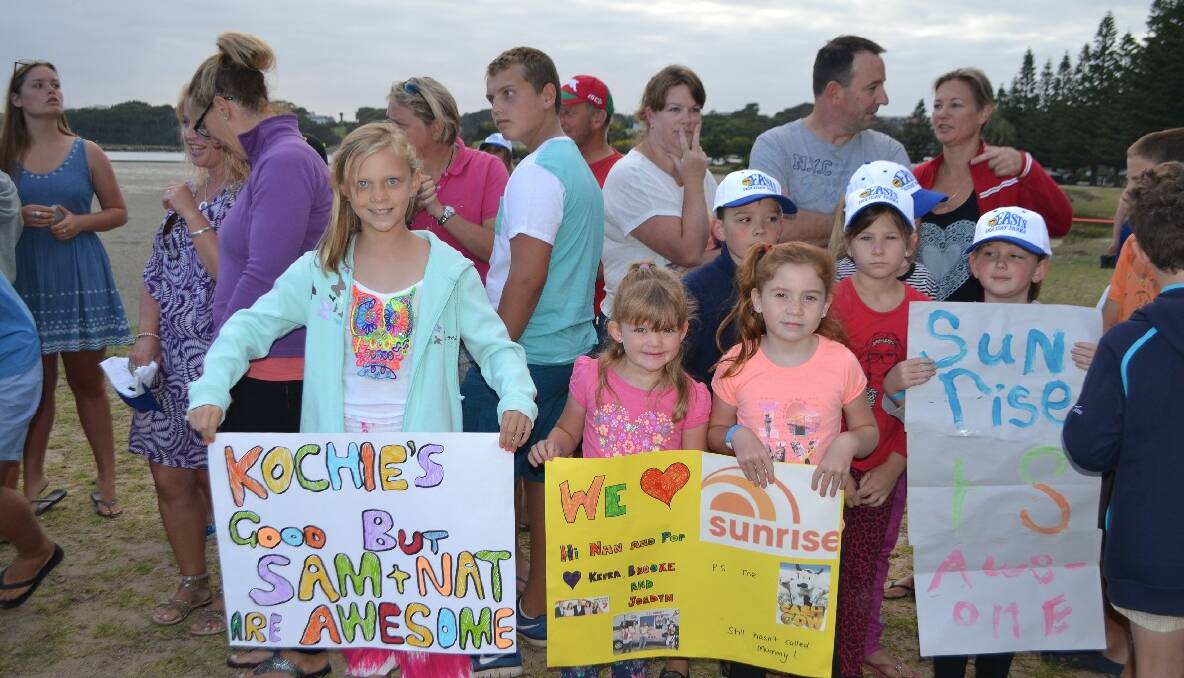 VISITING KIDS: Kelsey Smith from Lilli Pilli, Brooke and Kiera Hitchcock from Nowra with Ben Wiggan, Olivia and Lauren Smits and Amy Wiggan from Canberra and Batemans Bay and their signs. 