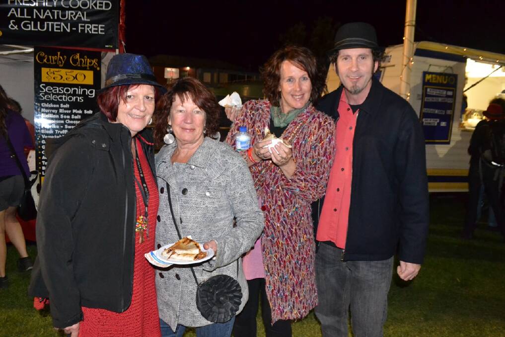 TILBA CREW: Gaye Donnelly, Carol Kemp from Tilba and Kathy Kroger with Steve Purdie from Melbourne at the Narooma Blues Fest on Sunday.