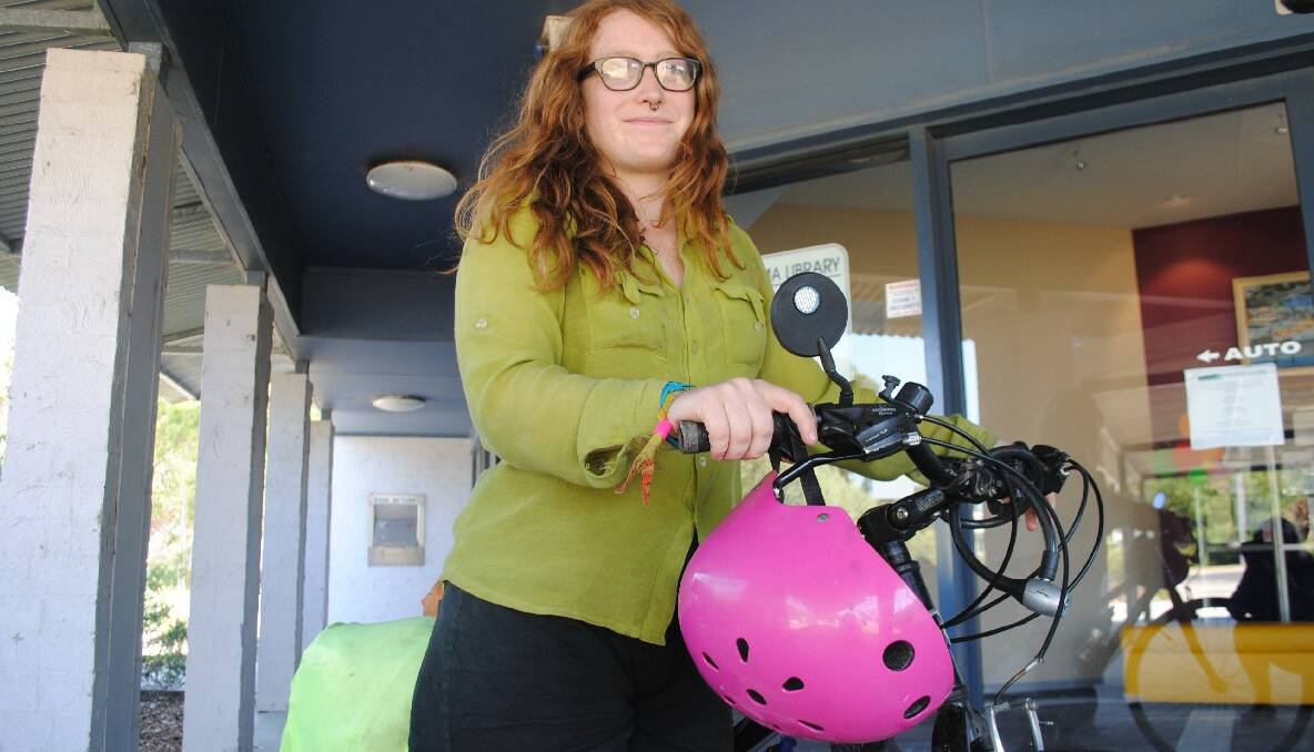 ON YA BIKE: Sonia Ablett of Melbourne takes a break at the Narooma Library on Monday. 