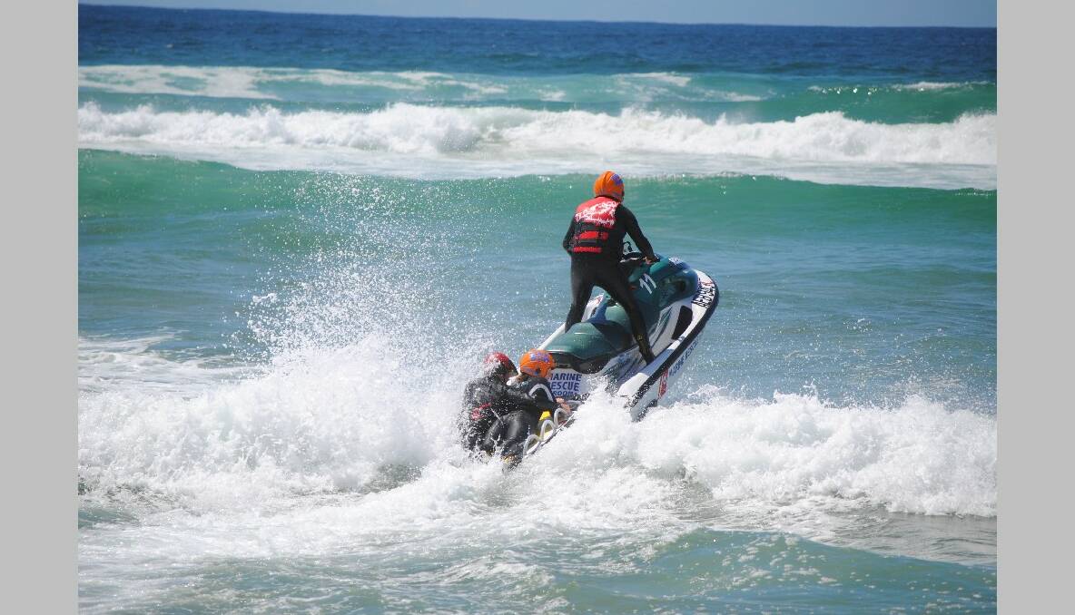 WAVE JUMP: The three successful trainees head off over a wave on the Marine Rescue Jet Ski. 