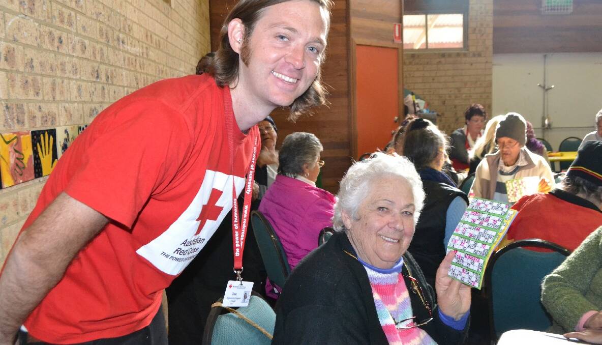 BINGO WINNER: Red Cross worker Tom Noonan with Aunty Betty Hancock, who won two rounds of bingo donating one of her prizes to a friend.  