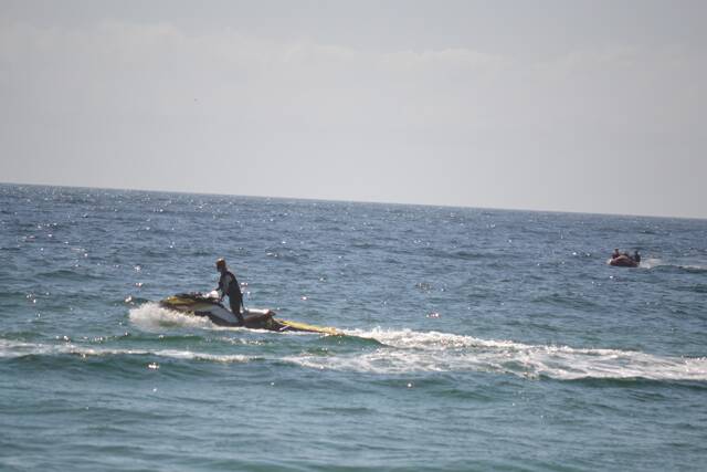 JET-SKI SEARCH: The surf lifesaving Jet-ski and a rubber duck head to look for any sharks.