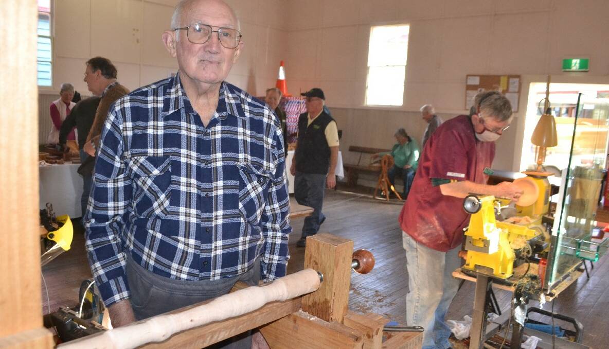 LATHE MAN: One of the operators of several lathes at the show was Warren Randall of Tuross who demonstrated his foot-powered bow lathe. 