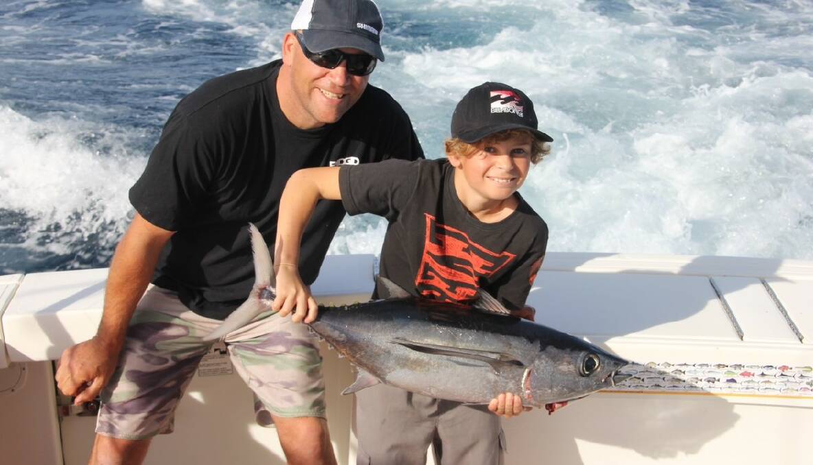 ALBACORE AROUND: Narooma local Hoots Cowie and his son Digger went fishing with Pete Davies and got their first albacore ever. 