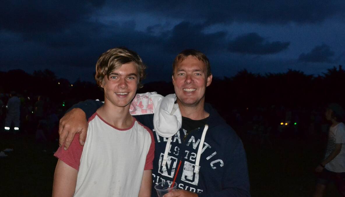 FATHER AND SON: Adam Morris and his son at the Narooma carols. 