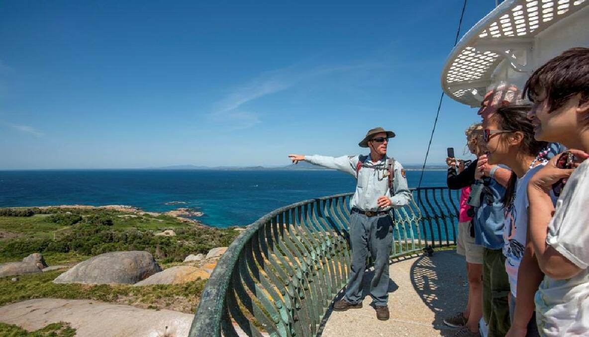 ISLAND VIEW: Montague Island field officer Brent Gresty leads a day tour on top of the Montague Island lighthouse. Photo by Batemans Marine Park ranger Justin Gilligan 