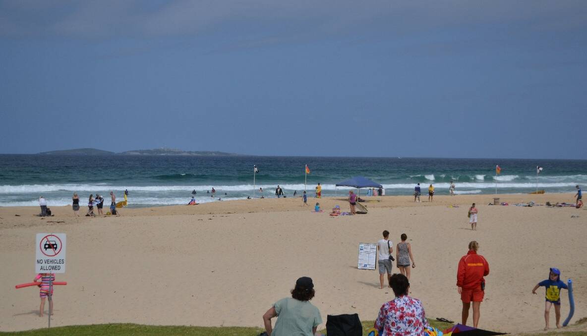 BUSY BUSY: The beach and inlet at Narooma were packed with tourists this week. 
