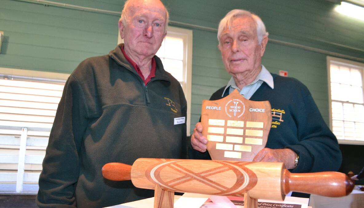 PEOPLE’S CHOICE: Eurobodalla Woodies president Des Jeffery congratulates People’s Choice winner Len Newman of Malua Bay, who made a Celtic knot rolling pin.  