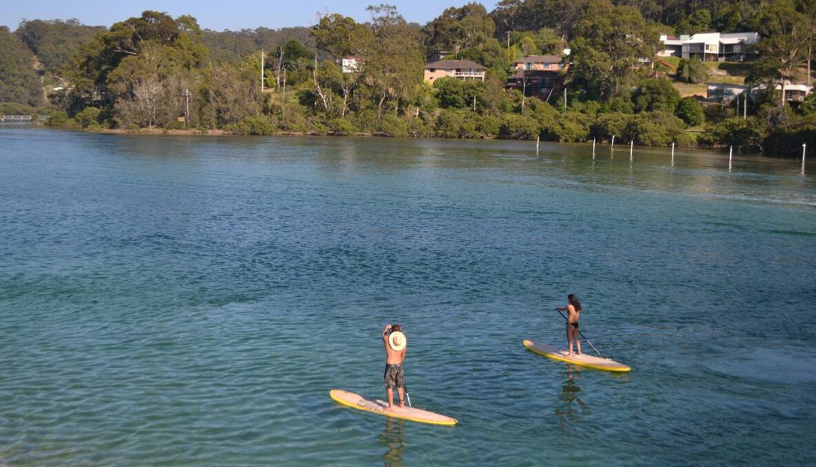 SUPPERS: Stand Up Paddle boarders are increasingly common on Wagonga Inlet.