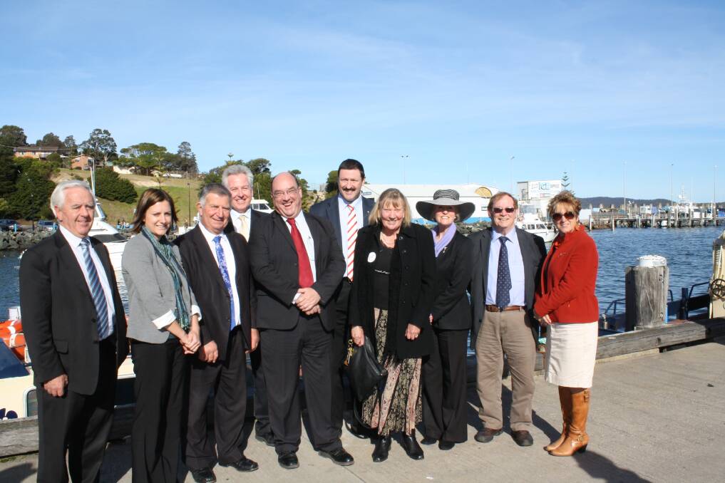 Smiles all round at Snug Cove Wharf in Eden last week after Member for Eden-Monaro Dr Mike Kelly announced $10million in Federal funding for a major expansion of the port. Dr Kelly celebrated with around 80 community members and (from left) Bega Valley Shire mayor Bill Taylor and councillors. 