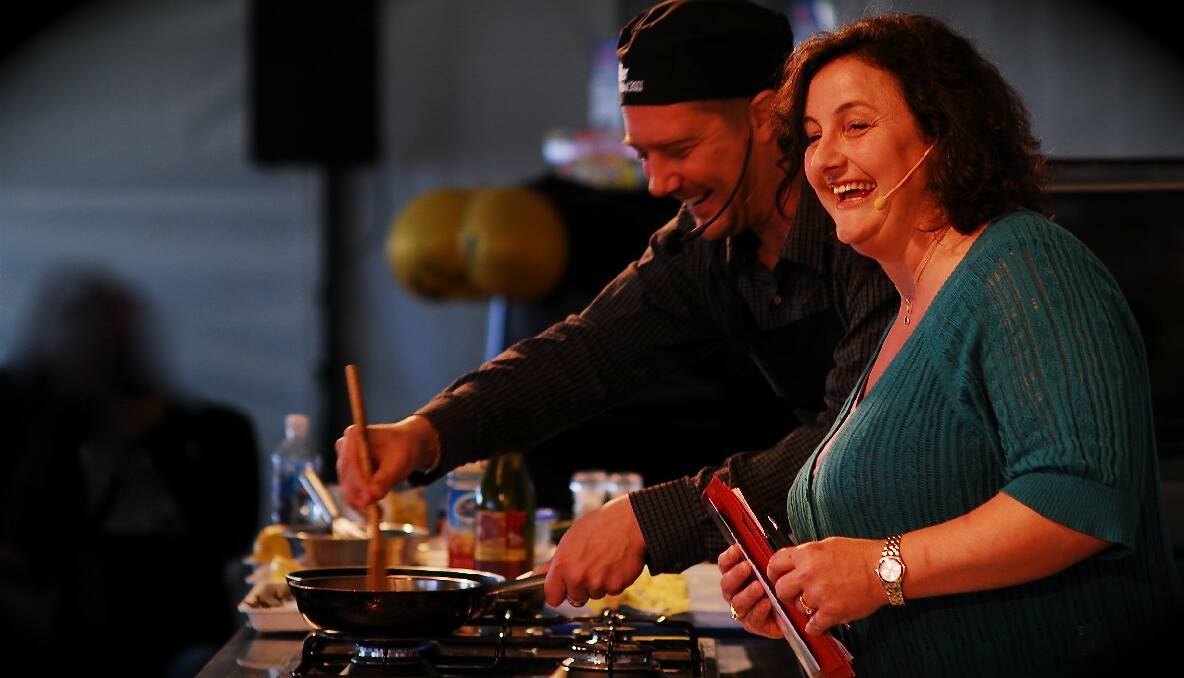 COMING BACK: Former MasterChef winner Julie Goodwin is delighted that she will be involved with the 2013 Narooma Oyster Festival, which she loves, and she is shown here compering at a previous festival. Photo courtesy Tim Burke, Twist Photography   