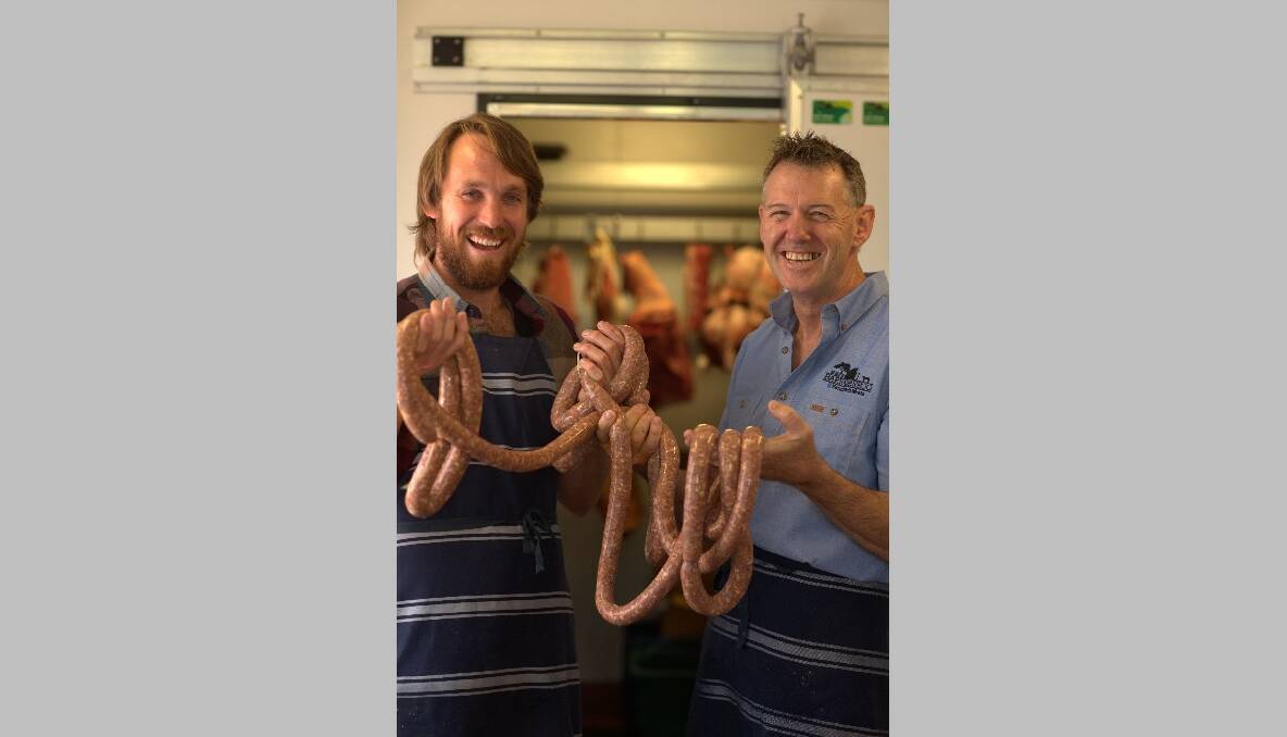 QUAAMA GOURMET: Host Paul West and Barrabarroo Meat’s John Tracey with their chilli and port sausages.