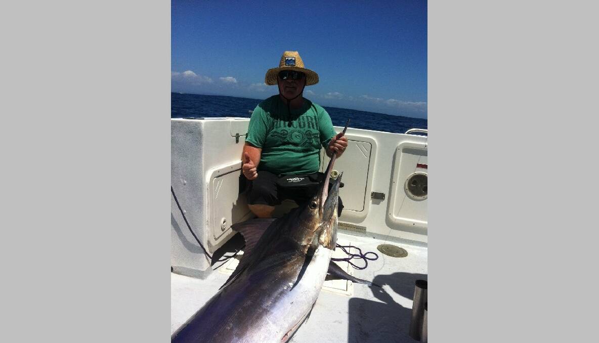 BLUE MARLIN: Greg Stevenson of Canberra and a 70kg blue marlin caught yesterday on Nitro. 