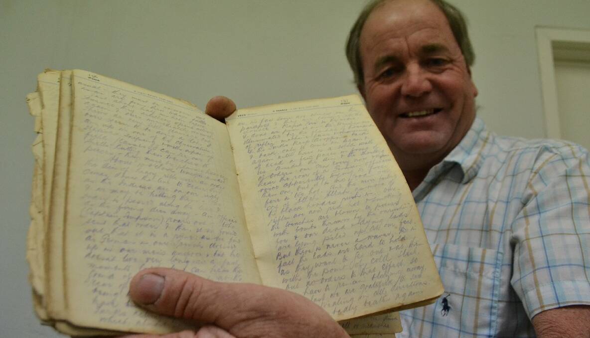 DIGGER’S DIARY: Bill Dudley with his grandfather William’s diary written on the battlefields of World War I. 