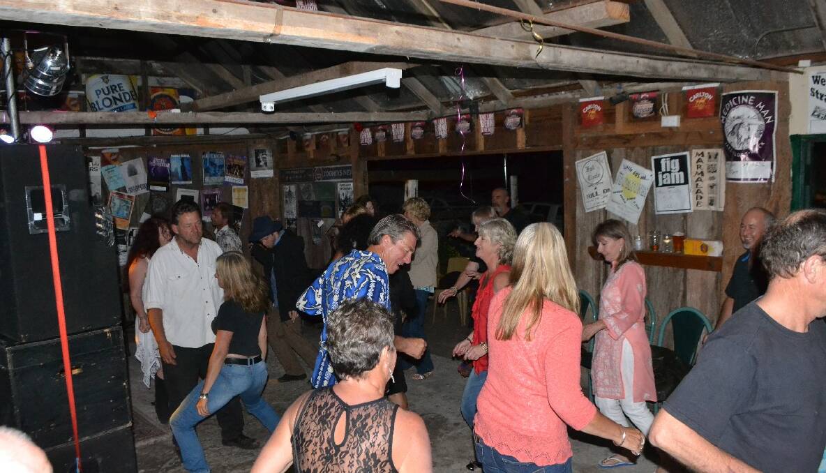   DANCING CREW: Out on the dance floor in the beer garden shed at The Dromedary Hotel at Central Tilba on New Year’s Eve. Photo by Stan Gorton