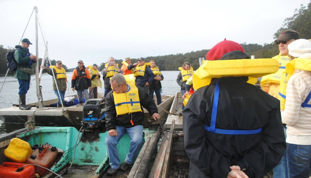 ON TOUR: Oyster growers lead local landowners on a tour of Narooma's Wagonga Inlet on Saturday. 