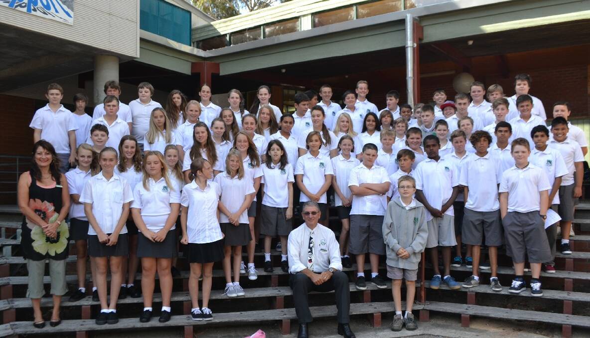 YEAR SEVENS: The Year 7 group that started at Narooma High School this week with principal Tony Fahey in the foreground and year advisor Lyn Schroder to the left. 