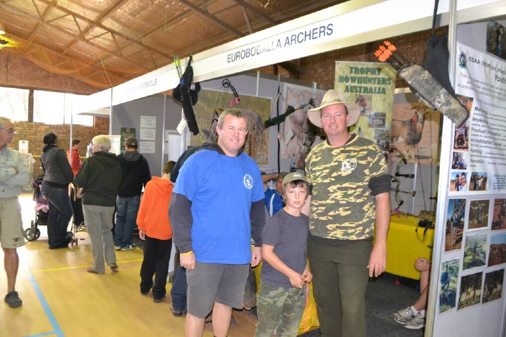 EURO ARCHERS: At the Eurobodalla Archers stall are club members Andrew Hearne and Ben and Paul Fish of Batemans Bay. 