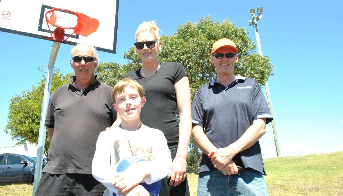 KEY PLAYERS: President of the Tuross Progress Association Lei Parker (back left), world champion basketball player Lauren Jackson, Eurobodalla Shire Council mayor Lindsay Brown with Vincent Edwards of Tuross Head who threw the first official hoop. 