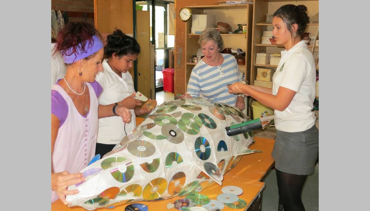 FESTIVAL FISH: Narooma High art teacher Jenni Bourke, Lena Campbell, Judy Glover and Mikaela Donovan work on enhancing fish for this year’s Narooma Oyster Festival. 