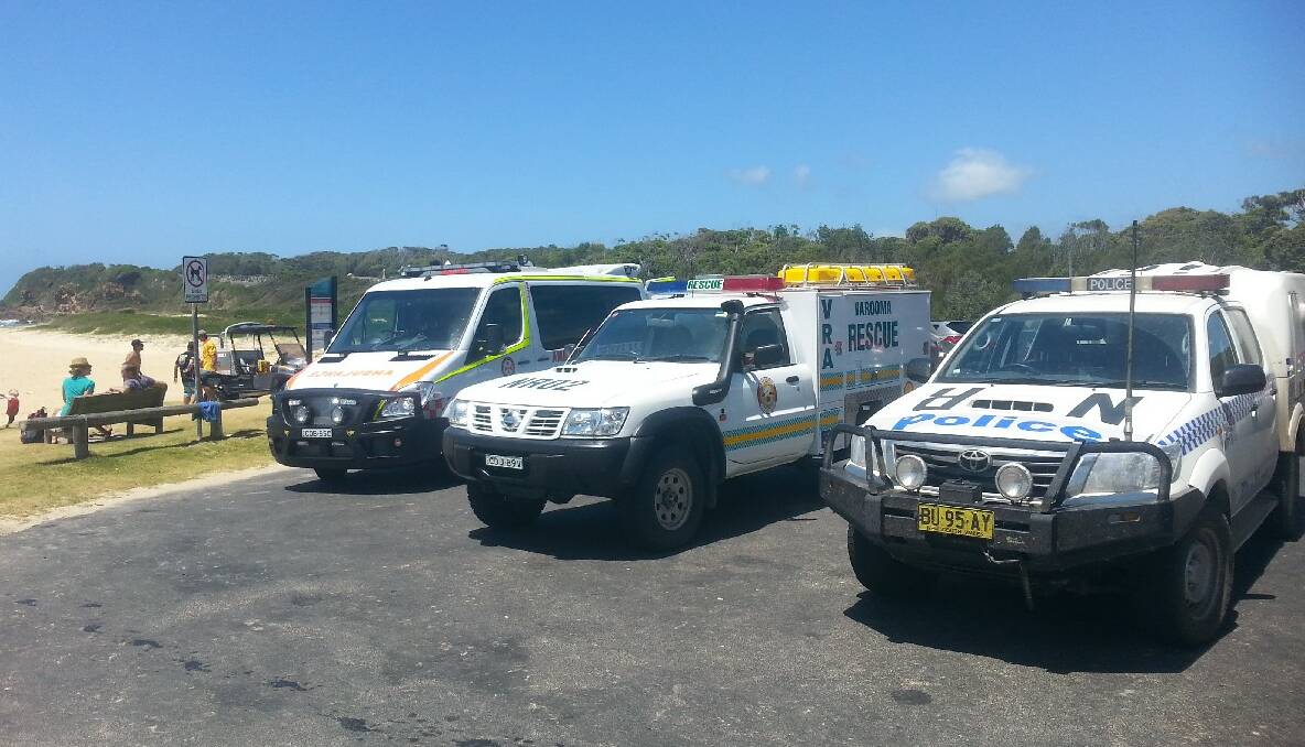 EMERGENCY VEHICLES: The ambulance, VRA truck and police vehicle at the Narooma Surf Life Saving Club. 