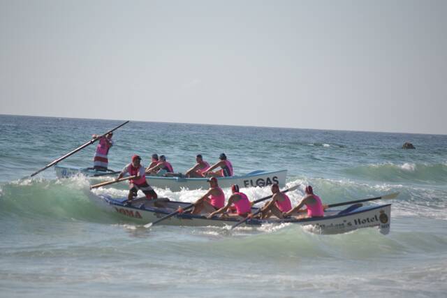 SURF ACTION: One of Narooma SLSC surfboat teams comes home in the sprints. Photo by Stan Gorton – Narooma News 