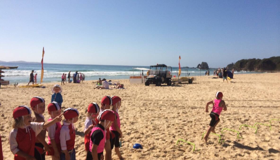NIPPERS TRAINING: Narooma Nippers learn how to do flags on Narooma surf beach on Sunday. 