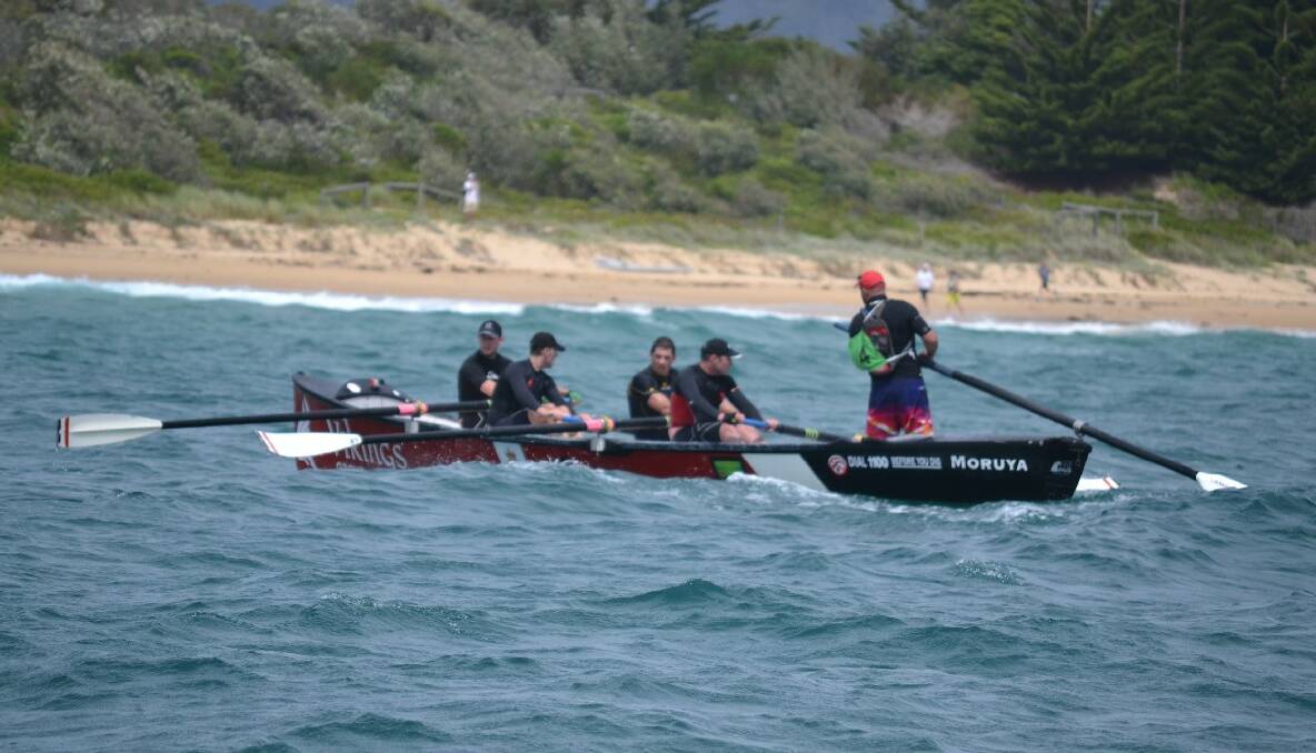 One of the Viking teams  row to the finish at Bermagui in Day 4 of the 2013/2014 George Bass Surfboat Marathon.