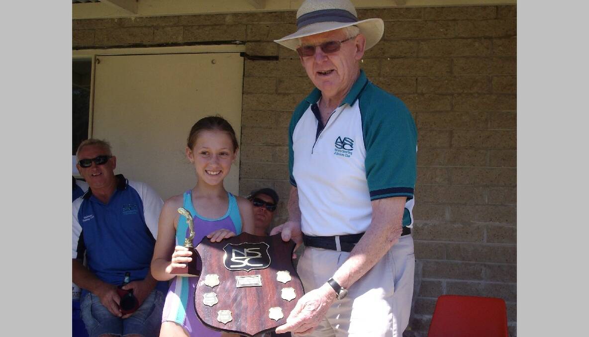 SPORTS PERSON: Hayley Stubbs was named the Narooma Sporting and Services Club Junior Sports Person of the Year at the Dalmeny Fishing Club Christmas party recently receiving the award from NSSC sporting director Noel O’Hehir. 