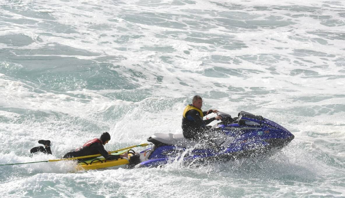 WAVE RUNNERS: Tony Lawson takes over on the Jet-ski taking fellow big wave rider Morgan Evans out for his next wave. 