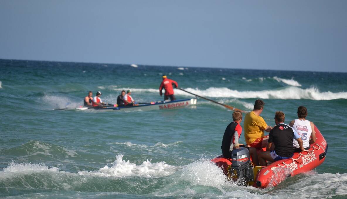 TRAINING: The Narooma George Bass Surfboat Marathon crew training off Narooma’s main surf beach. Photo by Stan Gorton 
