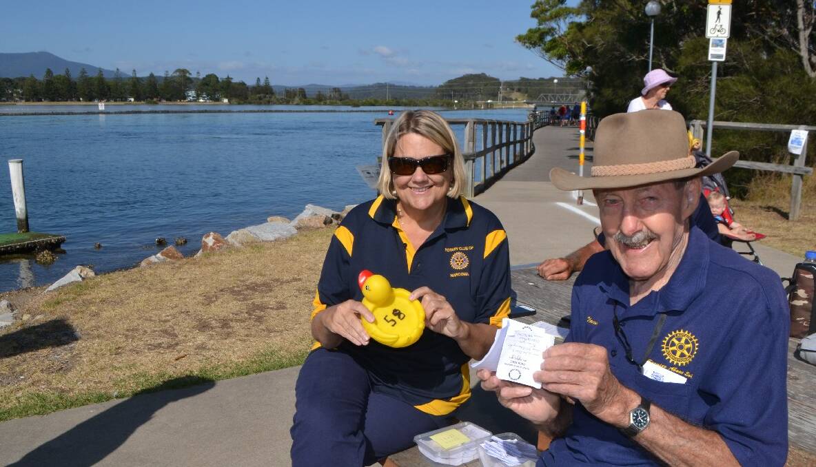 LAST DUCK: Charmaine White and Jack Whiting from Narooma Rotary with the last place duck.