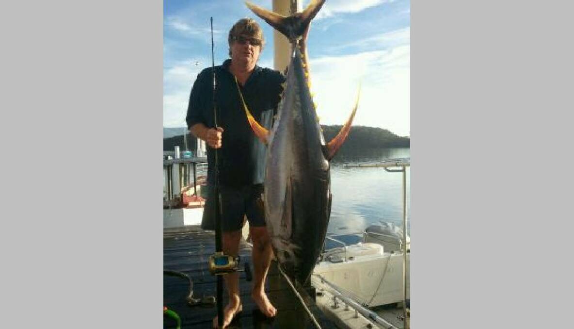 BIG YELLOWFIN: Narooma Sport and Gamefishing club member Ken Ribbon and the big yellowfin landed last week.