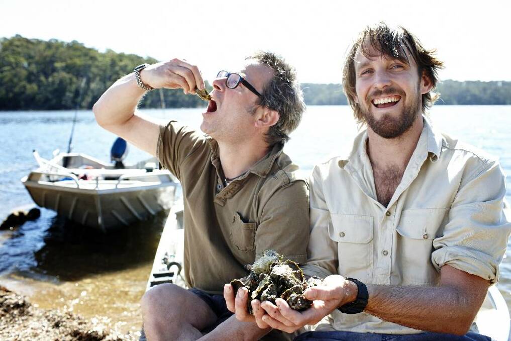 TILBA TIME: River Cottage UK and Australia hosts, Hugh Fearnley-Whittingstall (left) and Paul West (right) enjoying local oysters. Photo provided courtesy of Foxtel/Nicholas Wilson