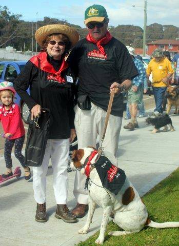 Brenda and Clive Cavey and their dog Toby.  Their shirts read “Rescued is my favourite breed”