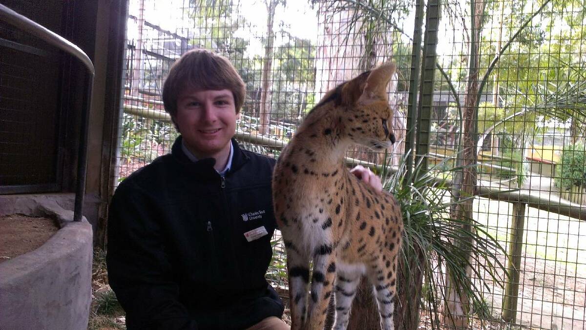 GETTING TO KNOW: Daniel Lawson with an African serval, which he has had the privilege of seeing in the wild in South Africa.